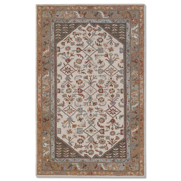 Nisa hand tufted woollen rug by Obeetee - angle view