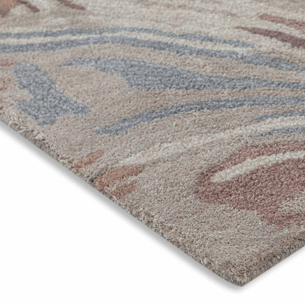 Waaiz hand tufted wool and viscose rug by Obeetee - angle view