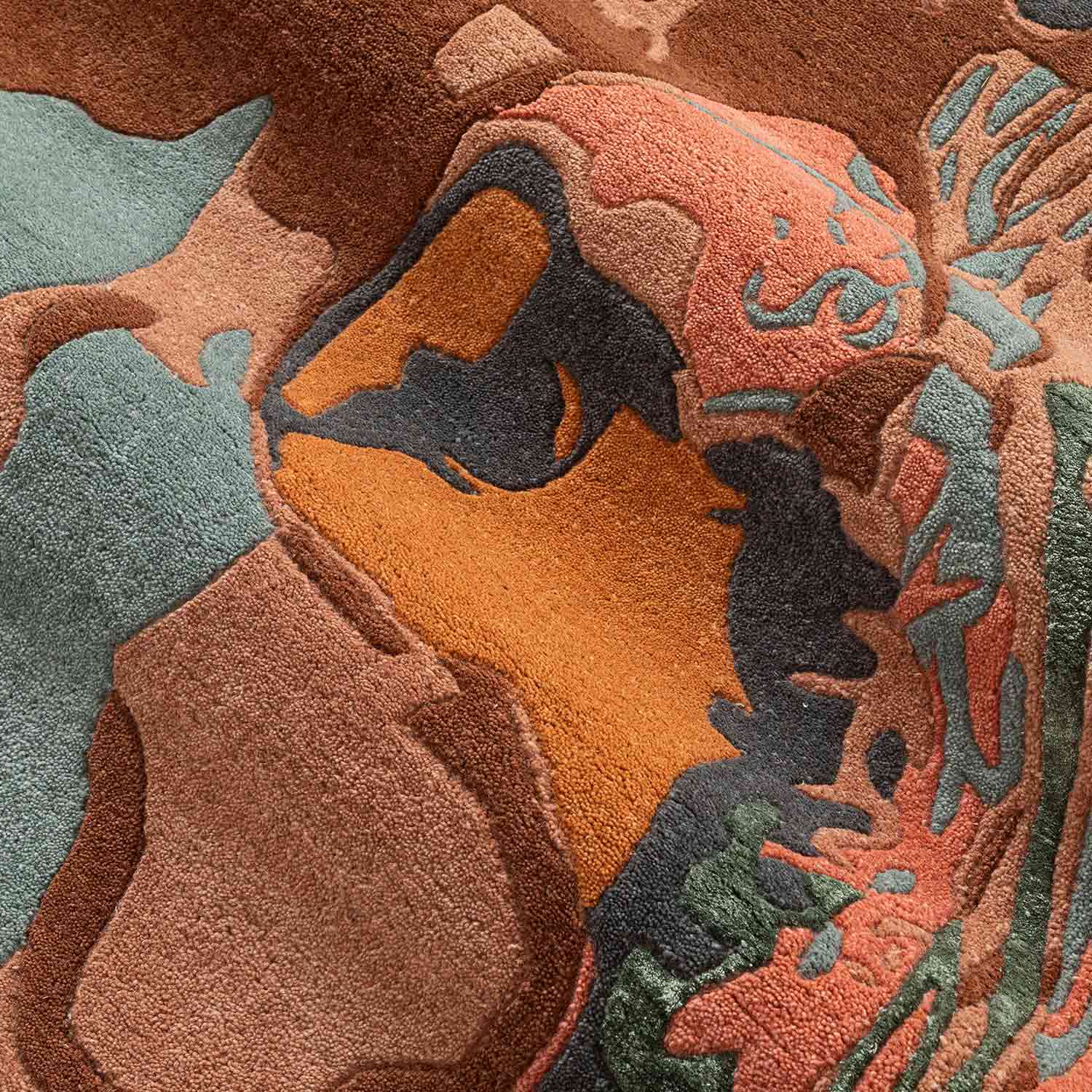 Close-up of a textured rug with earthy tones and abstract patterns.