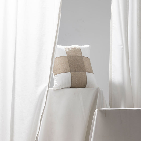 Quilted cushion cover with Kantha stitch patchwork by Abraham and Thakore for Obeetee - styled view